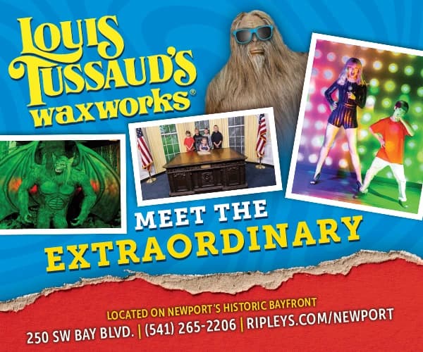 Promotional banner for “Louis Tussaud’s Waxworks,” “Meet the Extraordinary,” with phone and address text.